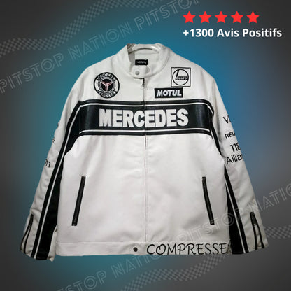 "Unisex white leather racing jacket with black Mercedes chest stripe, Motul and Castrol patches, and zip pockets."